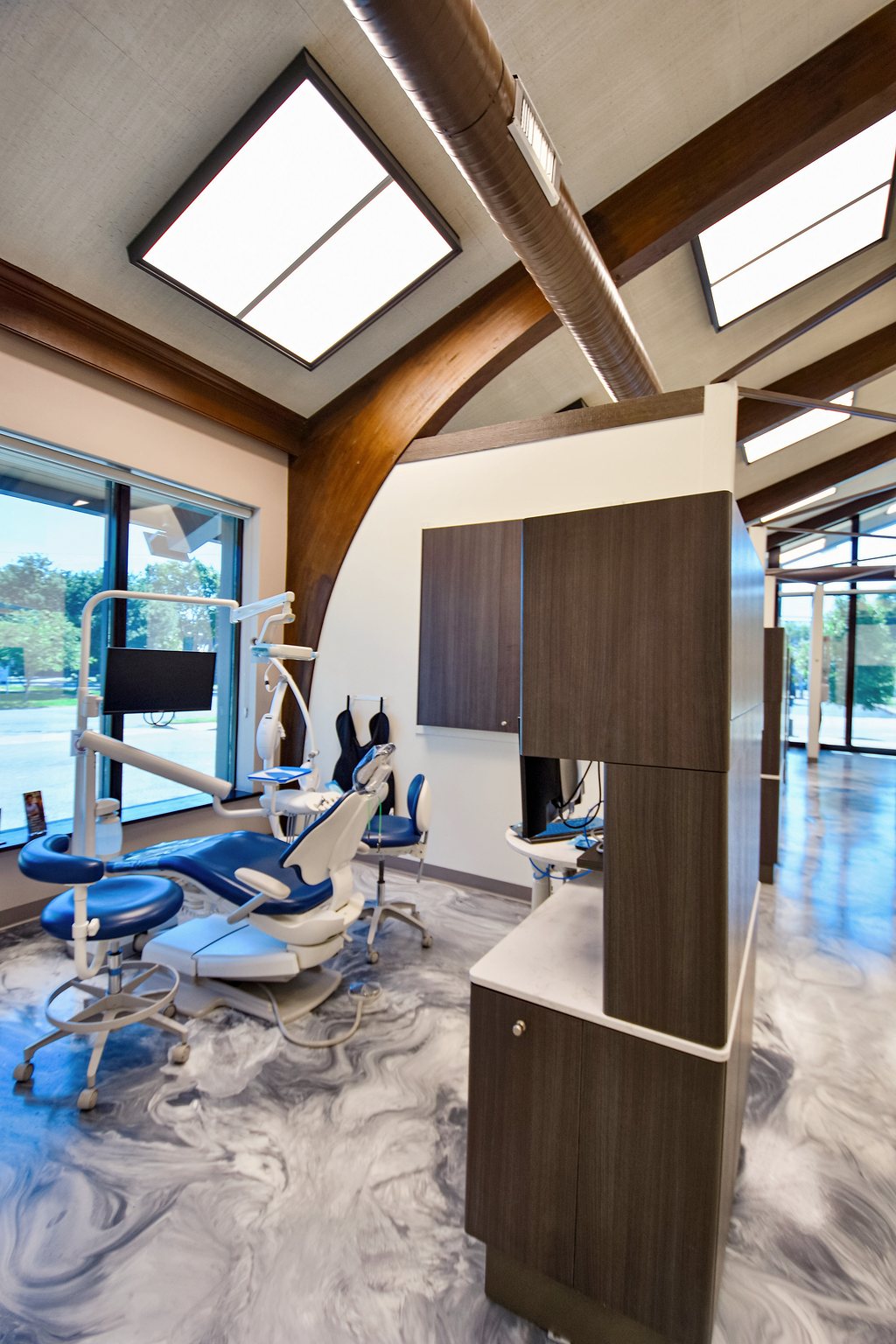 Treatment room with a vaulted wood ceiling at Glen Burnie Dental Group